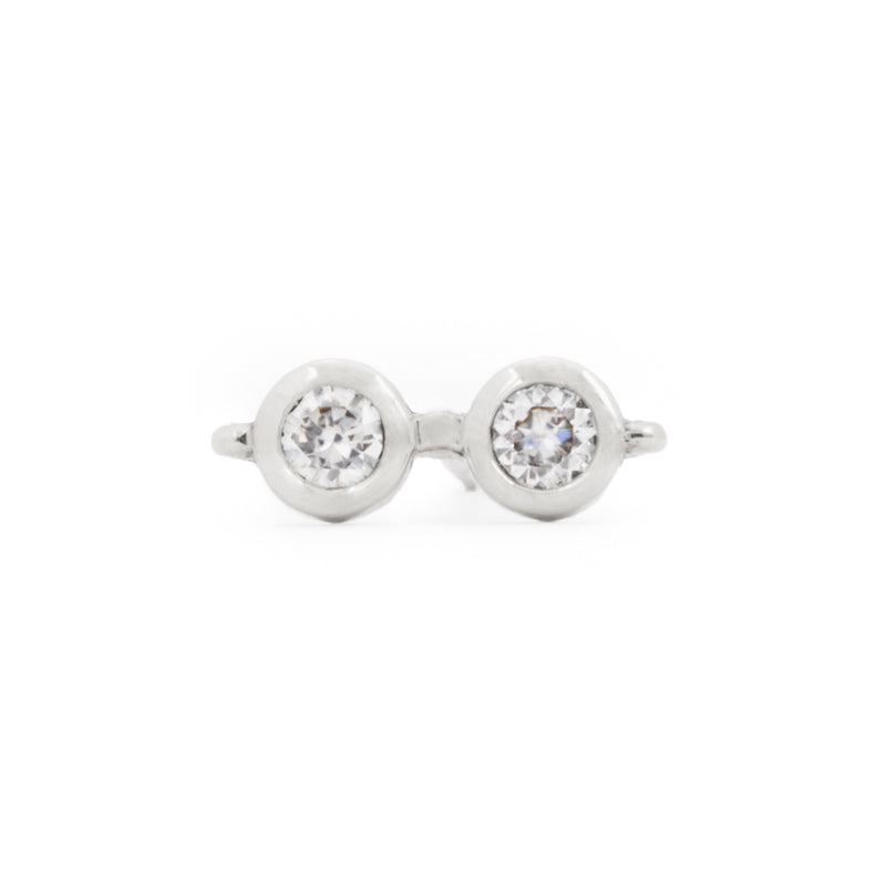 Close up front view of a single officially licensed Harry Potter Glasses Earring in sterling silver set with natural diamonds on a white background. Also available in solid 14k and 18k yellow gold. 